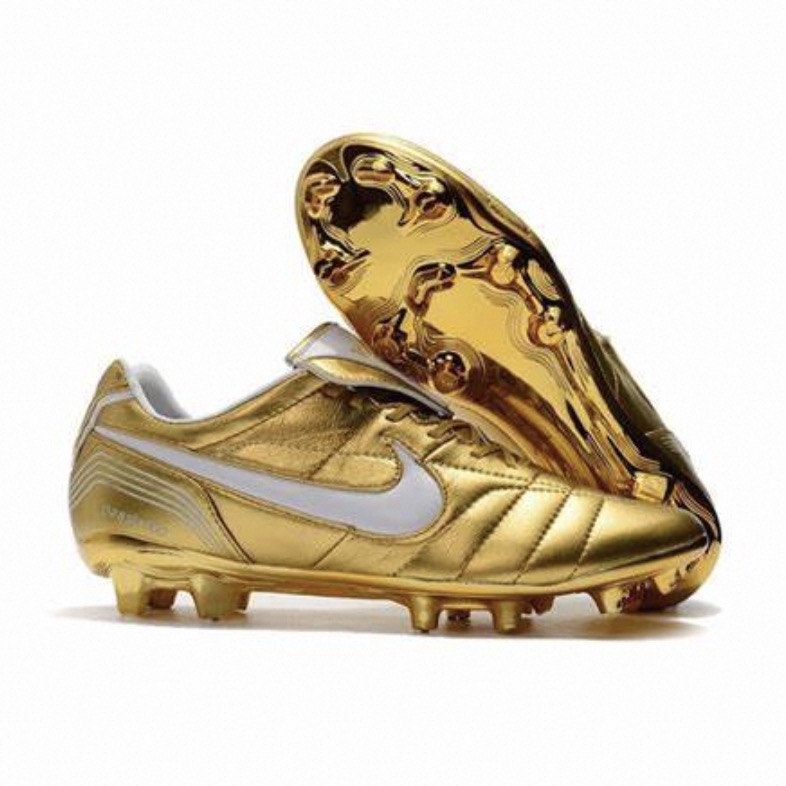 white and gold soccer cleats