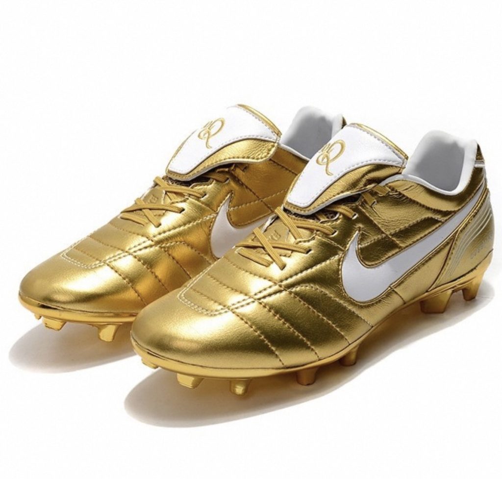 white and gold soccer cleats