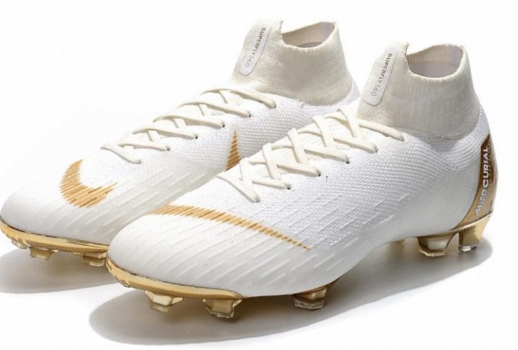 white and gold soccer cleats