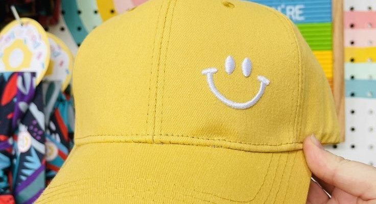 yellow baseball cap