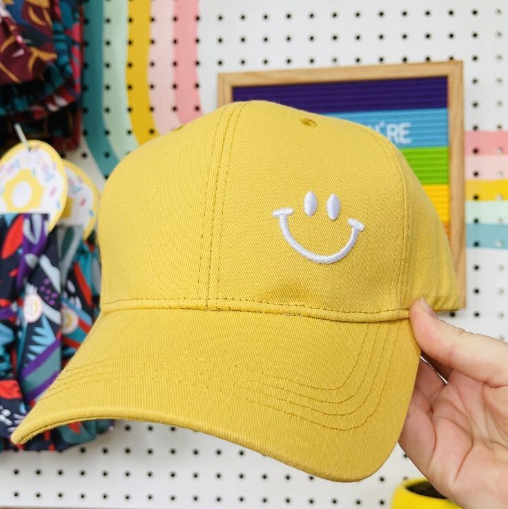 yellow baseball cap