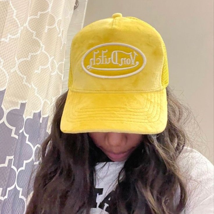 yellow baseball cap