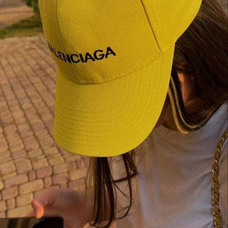 yellow baseball cap
