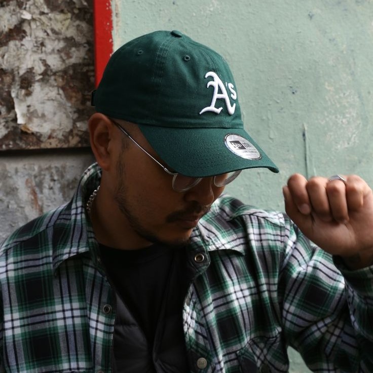 green baseball cap